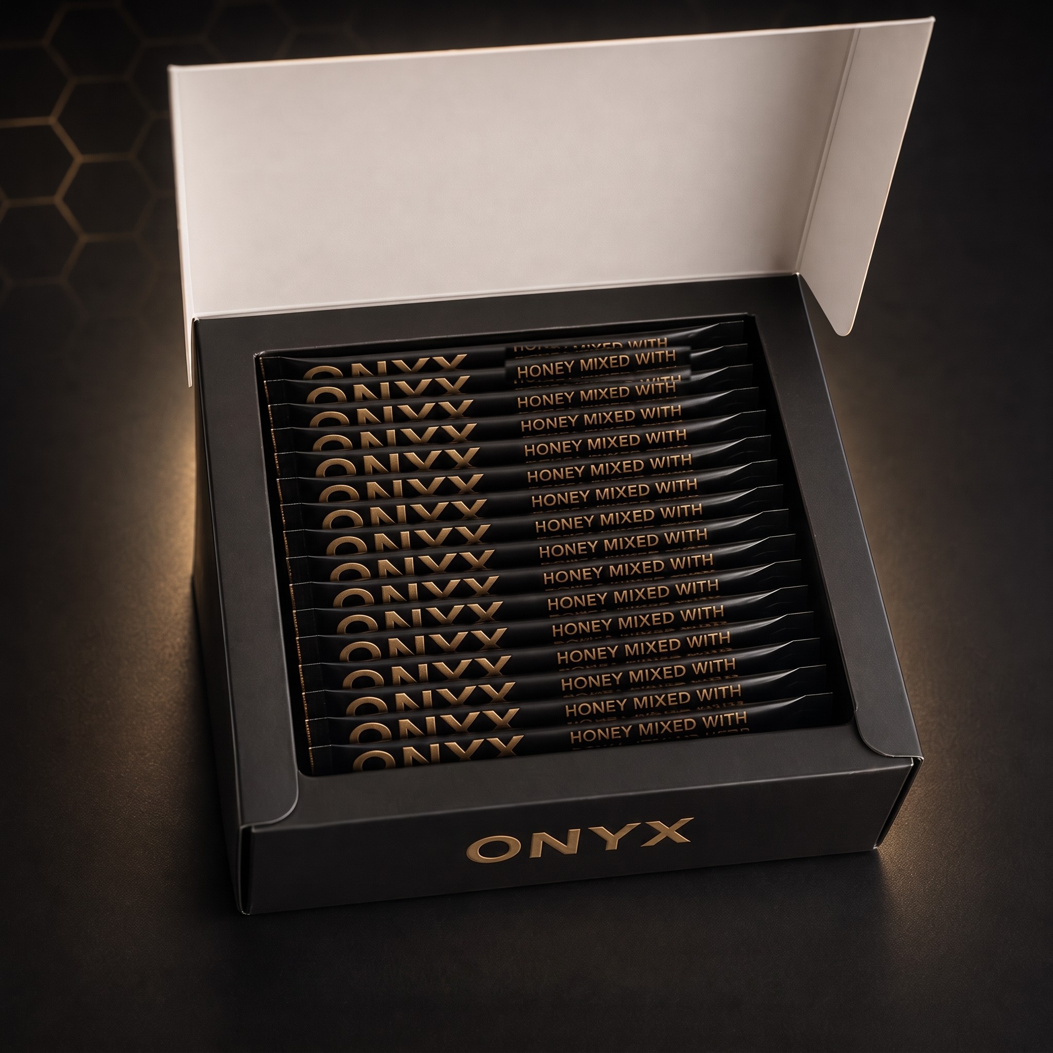 An open ONYX box showing 24 black honey sachets
